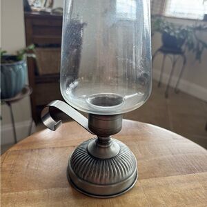 Vintage glass hurricane candle holder with a metal base. #67